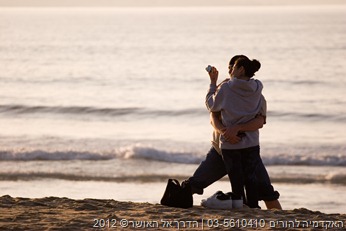 happy hispanic couple on beach